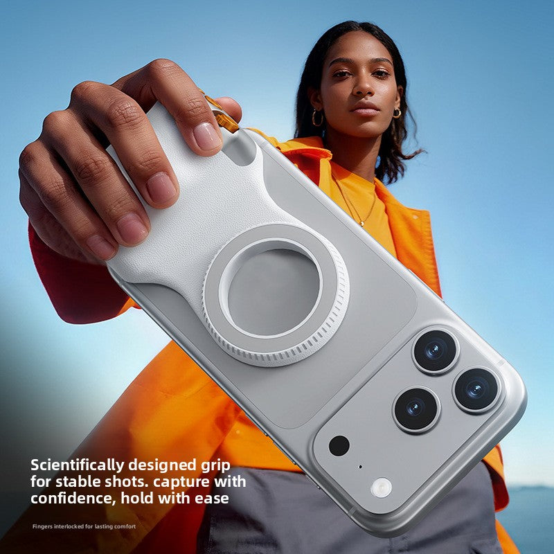 Hand holding the white magnetic camera grip attached to a phone for a steady shot