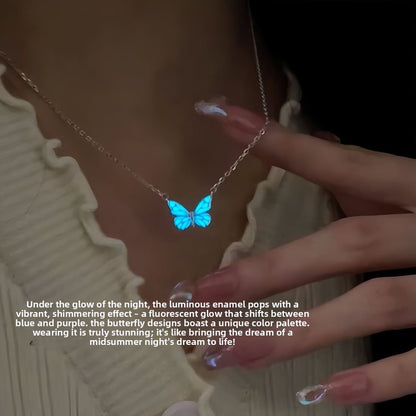 Blue butterfly pendant necklace glowing in the dark on a silver tone chain