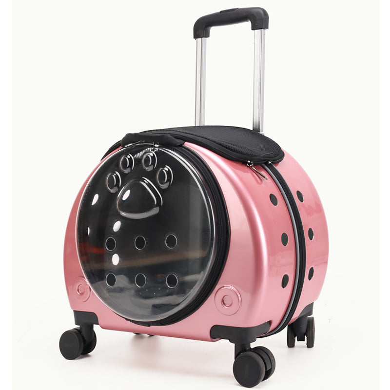 Deep pink metallic rolling pet carrier with a dark bubble window, pull rod and four swivel wheels