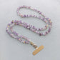 Beaded amethyst citrine lanyard shown beside a phone and everyday carry items