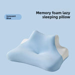 Blue contour memory foam pillow with a dipped centre and raised side wings on a plain background