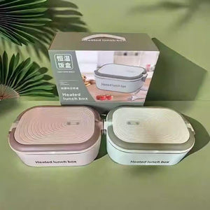 Mint green and brown electric heated lunch boxes shown with a printed retail gift box