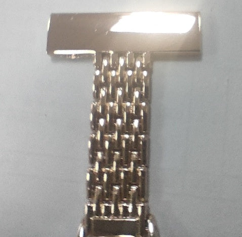 Nurse fob watch shown pinned by its brooch bar to display how it hangs