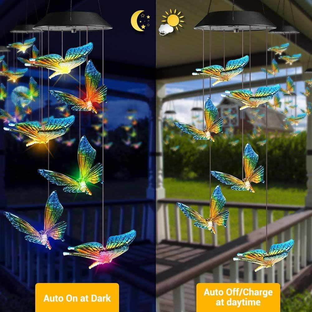 Blue and yellow butterfly LED figures hanging from a solar lamp head, glowing at night, black housing option
