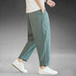 Mens wide leg cotton linen casual pants, relaxed straight cut to an ankle length hem, on model