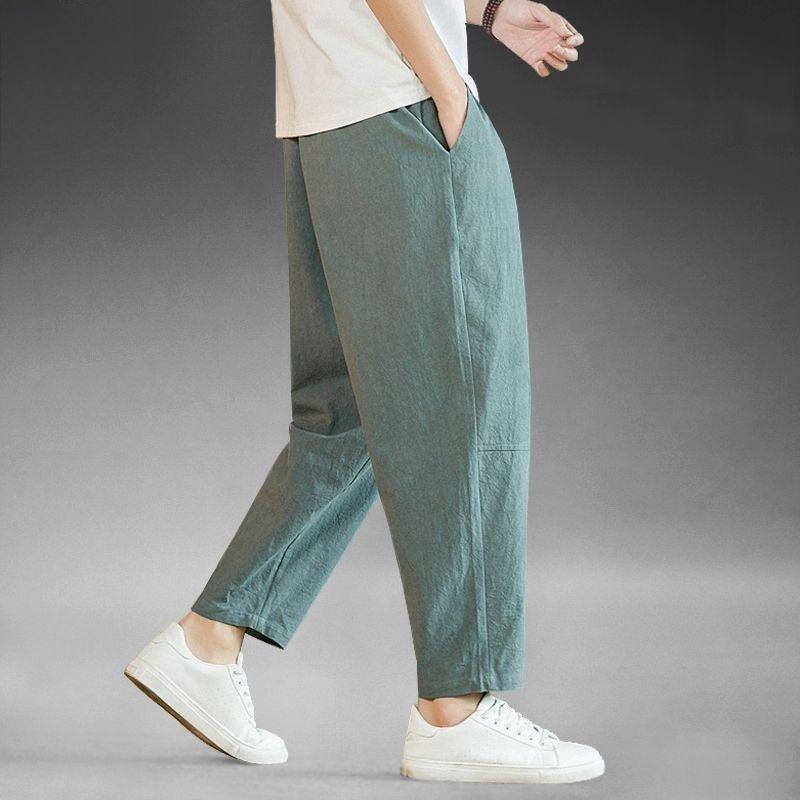 Mens wide leg cotton linen casual pants, relaxed straight cut to an ankle length hem, on model