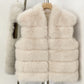 Beige White tiered vegan fur sleeveless vest in size L, front view on a wooden hanger