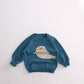 Blue cotton knit kids sweater with cream seal motif, ribbed neck and cuffs, for height 90cm