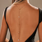 Back drape body chain worn low on a bare back