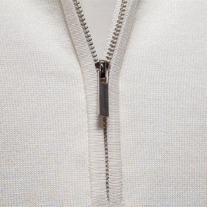 Men's knitted shirt side profile showing sleeve and knit drape