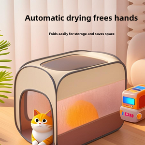 Foldable pet drying box with an orange cat resting inside the fabric enclosure
