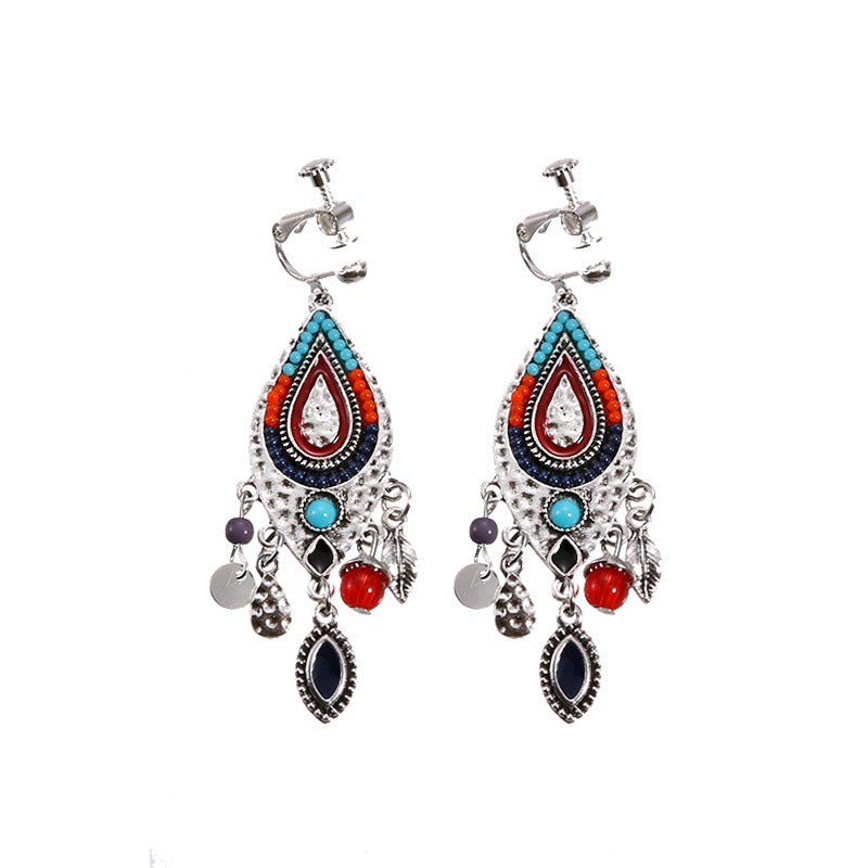 Vintage boho tassel clip-on earrings for non pierced ears, zinc alloy drop pair photographed on white background