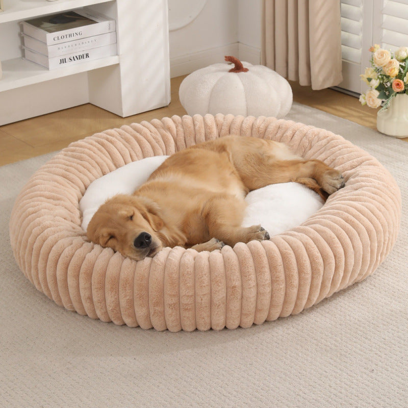 Round plush pet bed side profile showing the bolstered cradling rim