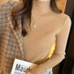 Fitted ribbed mock neck sweater in a quiet macaron tone shown close up on a model