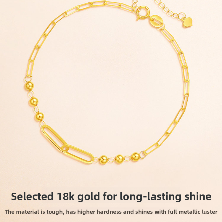 Close up of the faceted geometric gold beads and their cut detail