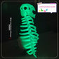 Glowing dinosaur skull and spine costume seen head to tail in a dark setting on a standing wearer
