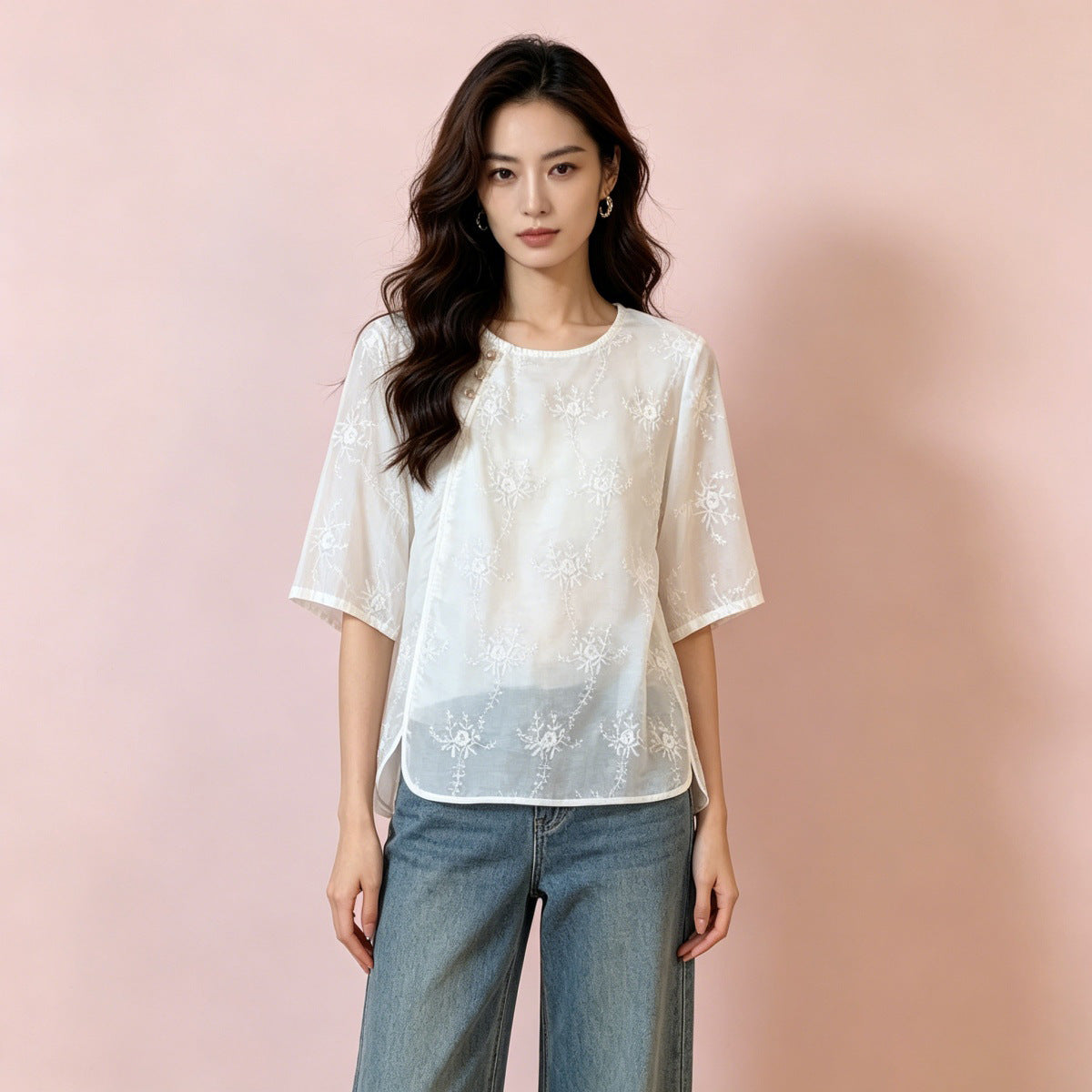 Relaxed ivory embroidered floral shirt styled with high waisted jeans