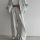 Light Gray zip-up hoodie and wide leg trousers set worn by a woman, option photo for size M