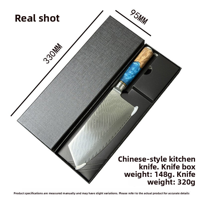 Damascus Chinese cleaver with blue resin handle lying in its wide black gift box with size markings