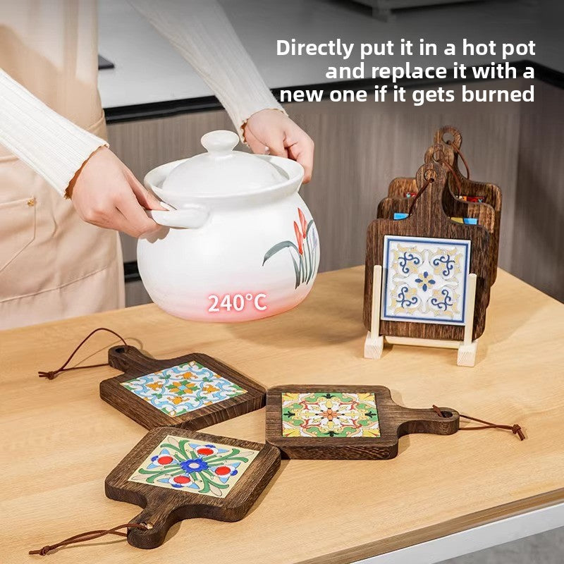 Ceramic tile wood trivets on a table beside a white casserole marked 240 degrees