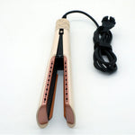Champagne hair straightener open showing rose gold ceramic plates and coiled black cord
