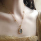 Woman wearing the rose mirror pendant necklace high on the chest on a beaded gold chain