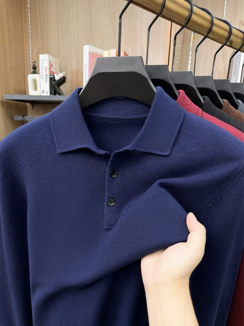 Navy blue knit polo collar and placket close up with fabric pulled in hand