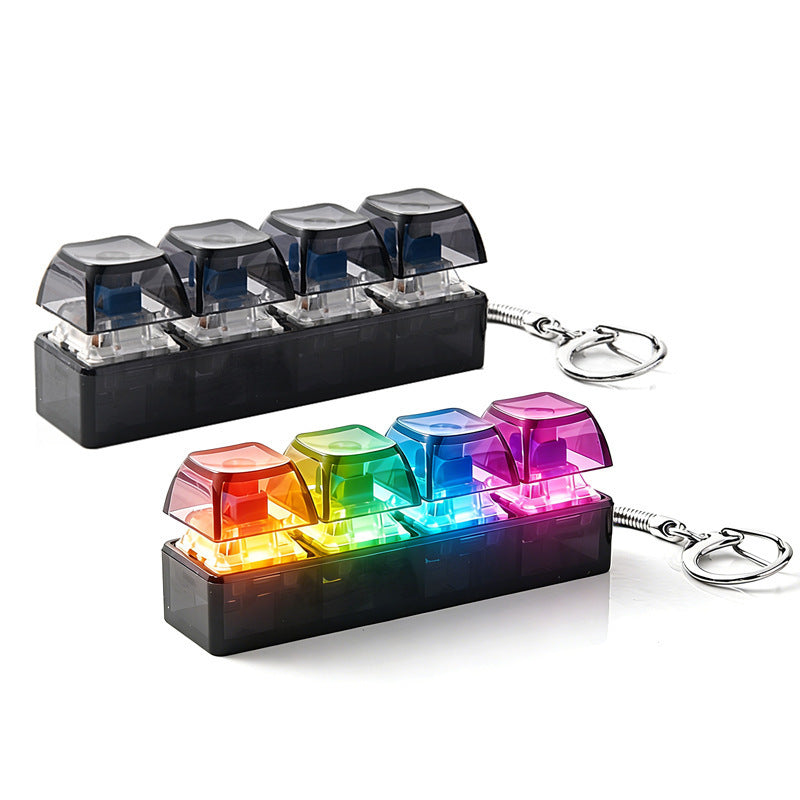 Two four key clicker keychains in smoke black, one plain and one lit in rainbow color