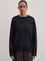 Knit pullover sweater shown for scale across sizes S to XL in four colours