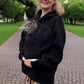 Black lamb fleece hoodie with a gray cat looking out of the chest pouch, park path, size S option