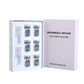 Microneedle serum kit with six 5 ml vials and two clear applicator caps in a white tray