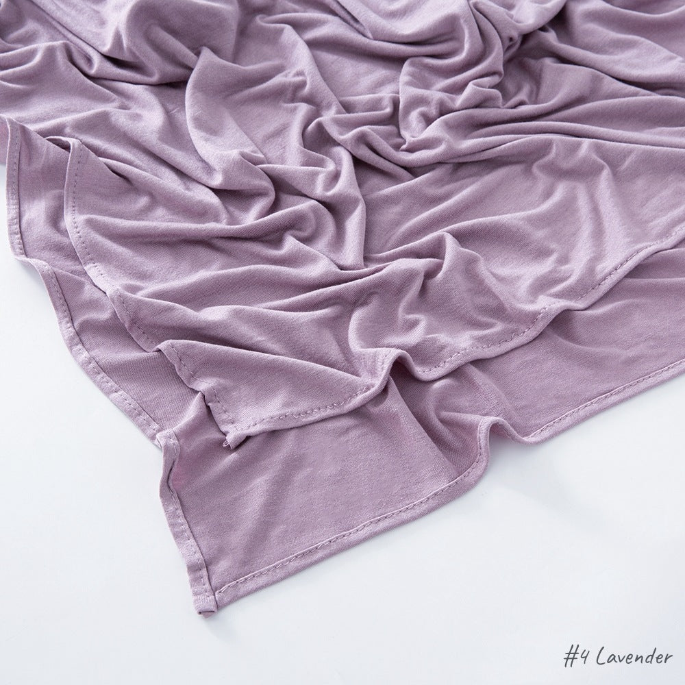 Flat lay of the soft modal cotton scarf wrap showing the even weave and finished border edge