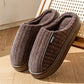 Brown striped ribbed fabric slippers with plush lining and thick sole on a wooden floor, EU 42-43 option
