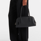 Leather shoulder handbag side profile showing the strap drop