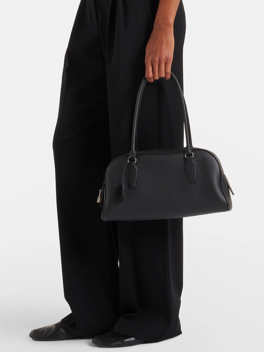 Leather shoulder handbag side profile showing the strap drop