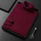 Men's slim-fit turtleneck sweater shown with the roll neck folded