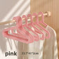 Pink Adult Hanger on a wooden rail beside a white garment, 23.7 x 41 x 2 cm