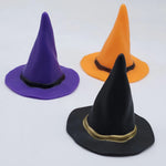 Three miniature witch hat ornaments in moulded PVC, black with gold band, purple and orange