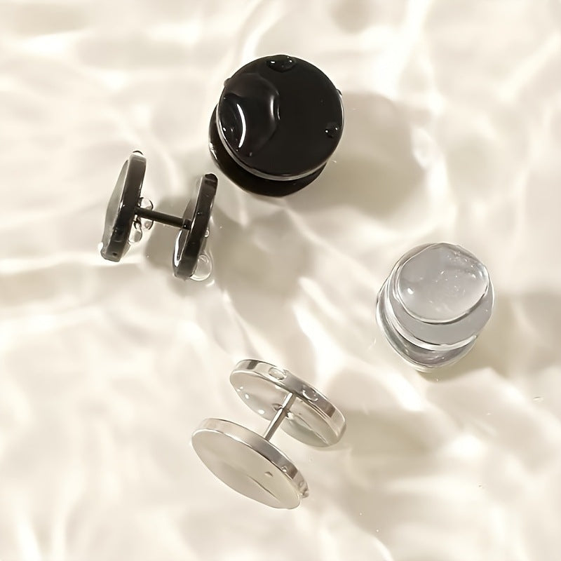 Black and steel disc barbell studs shown on a white surface, screw on backs visible