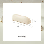 White waterproof toiletry bag styled with travel grooming essentials