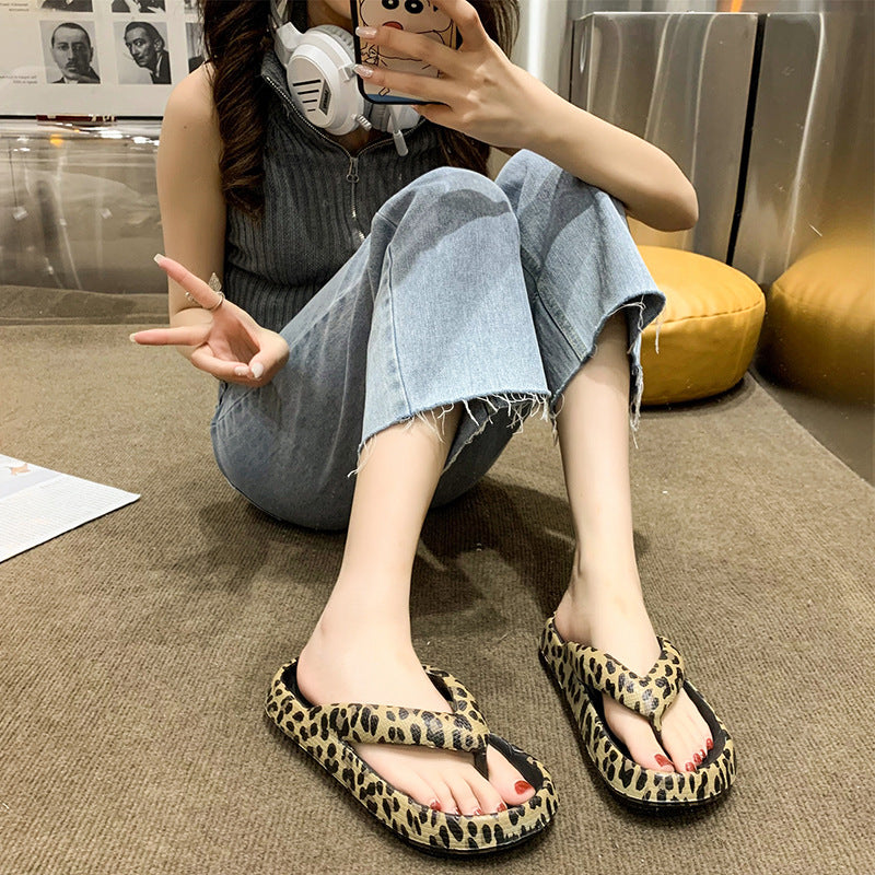 Thick sole EVA flip flops in leopard print worn with cropped jeans