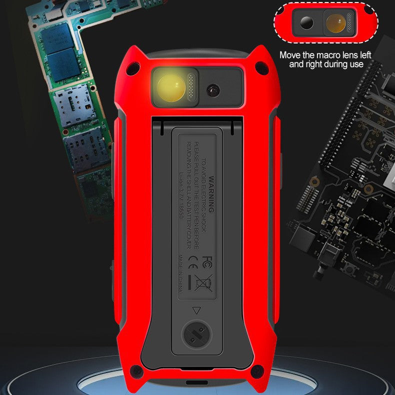 Back of the red ET14S multimeter showing the sliding macro infrared lens held above a bare circuit board