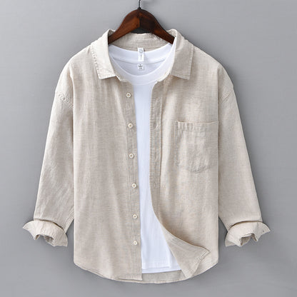 Mens cotton and linen blend long sleeve shirt in raw hemp beige on a wooden hanger, front view