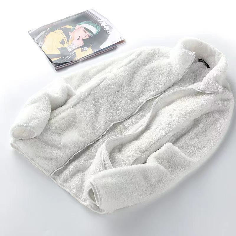Double sided plush fleece zip jacket with a tall stand collar shown flat on a plain background