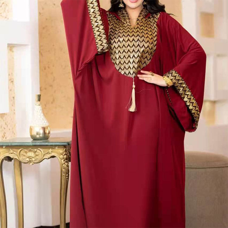 Burgundy chiffon kaftan with gold chevron yoke and beaded tassel indoors, Burgundy option