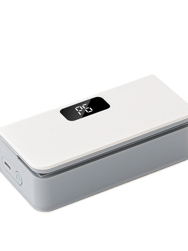 White mini heat sealer with a digital display, a side port and a round power button on a white background