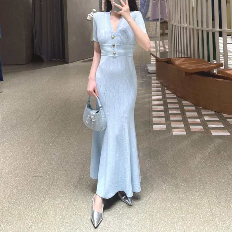 Elegant V-neck knitted dress styled with a jacket for the office