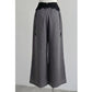 Back view of gray wide-leg pants with center back zip and waist ties