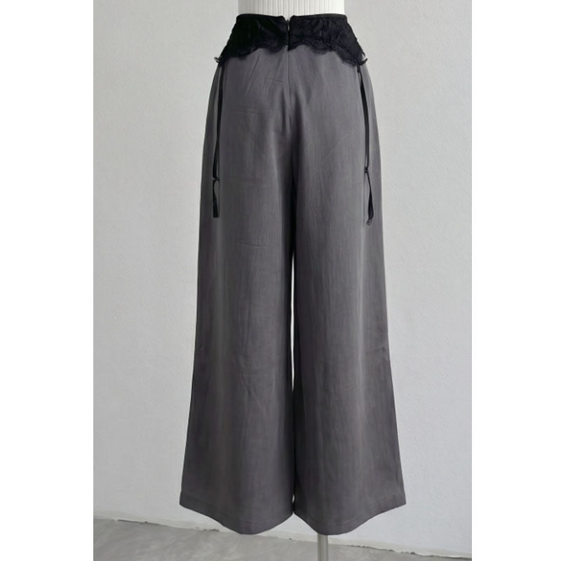 Back view of gray wide-leg pants with center back zip and waist ties