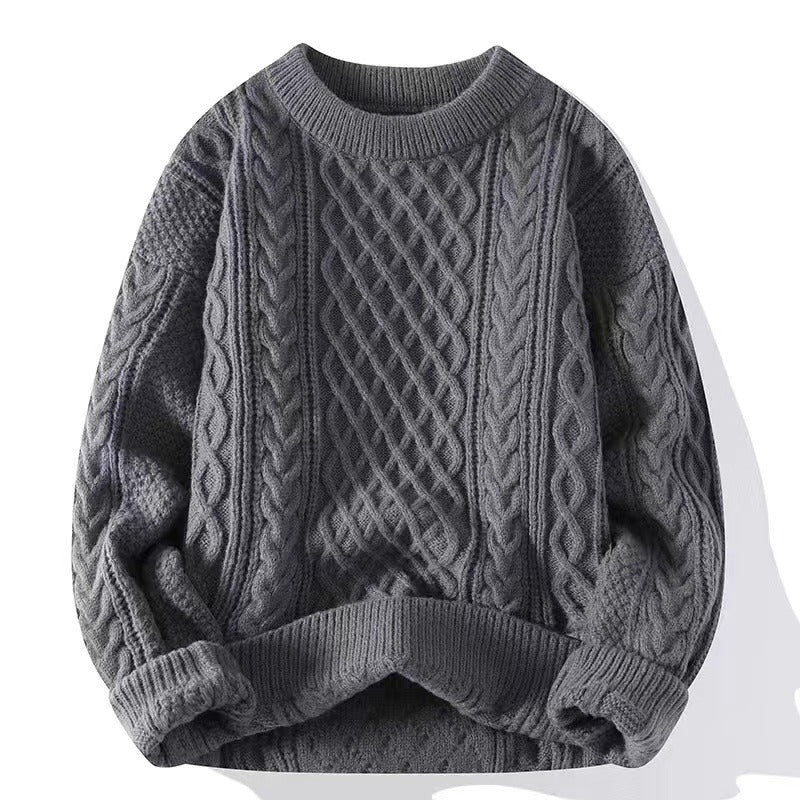 Close view of the cable twist knit texture on the crewneck pullover chest